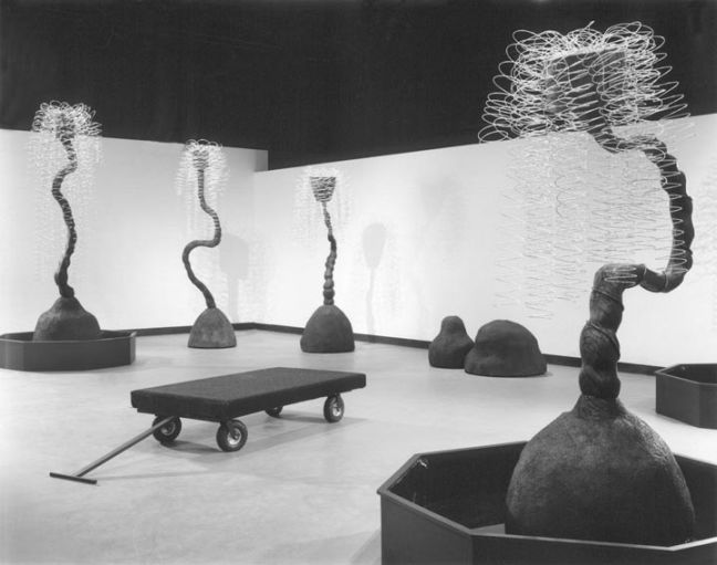 Gurgle, Weep, Flow, 2001, wood, water, concrete, steel, 35 x 58 feet, installation, by AOM subscriber Pat Warner.  Art Opportunities Monthly lists art competitions, art shows, grants, fellowships, public art commissions and other sources of money for artists working in all media, styles and geographic locations.